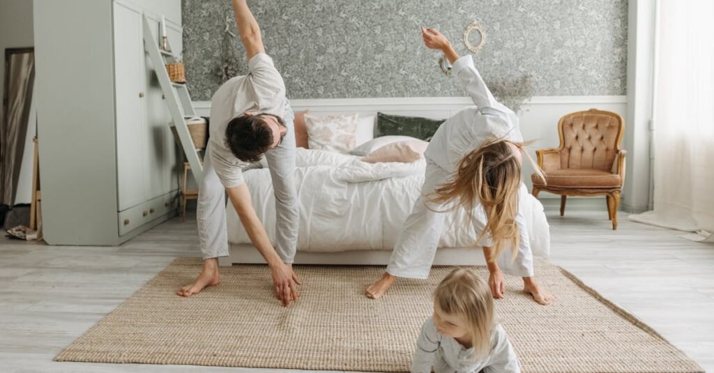 A family stretches together in a cozy bedroom, enjoying morning activities.